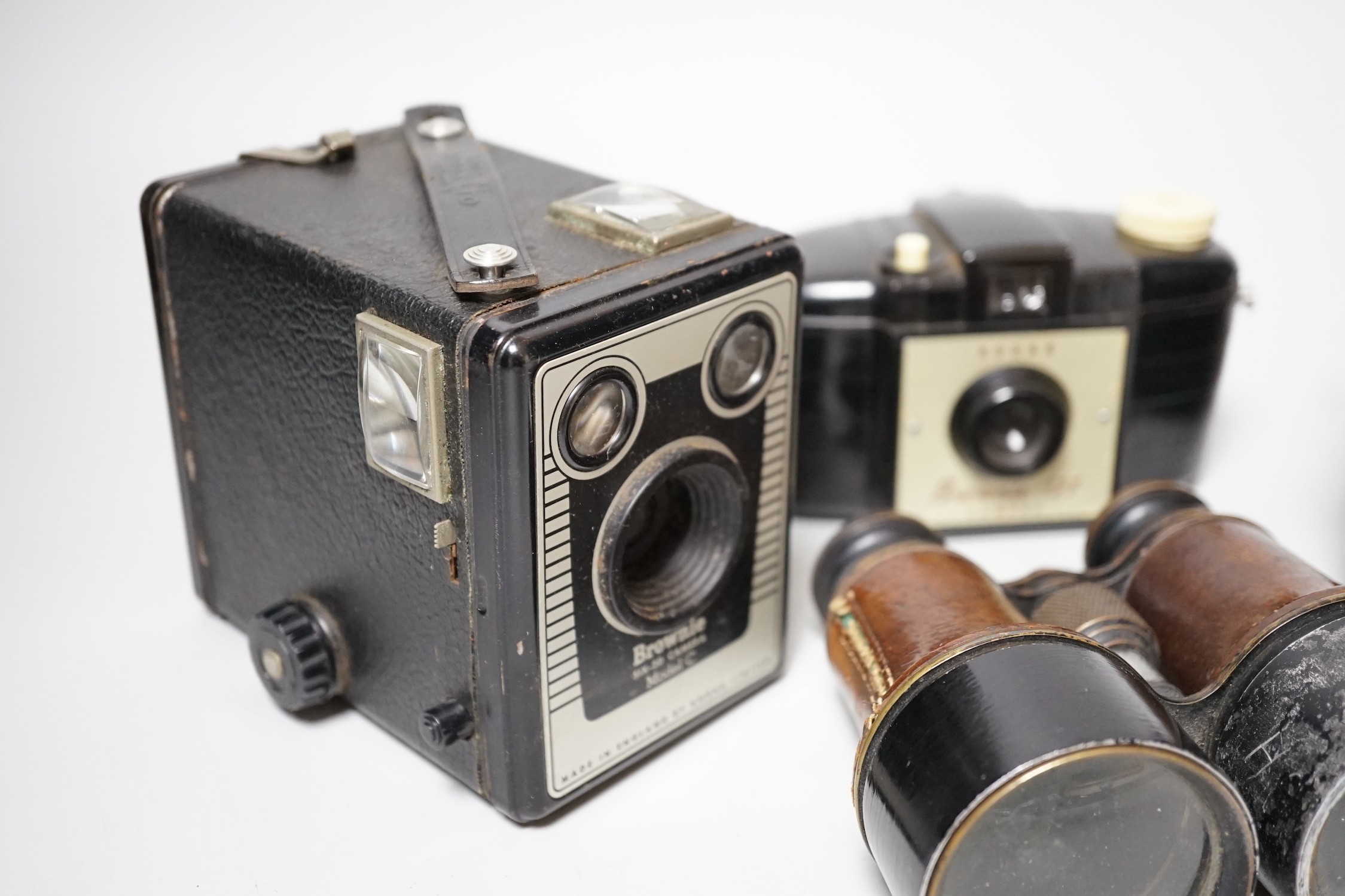 A quantity of camera equipment and a pair of military binoculars